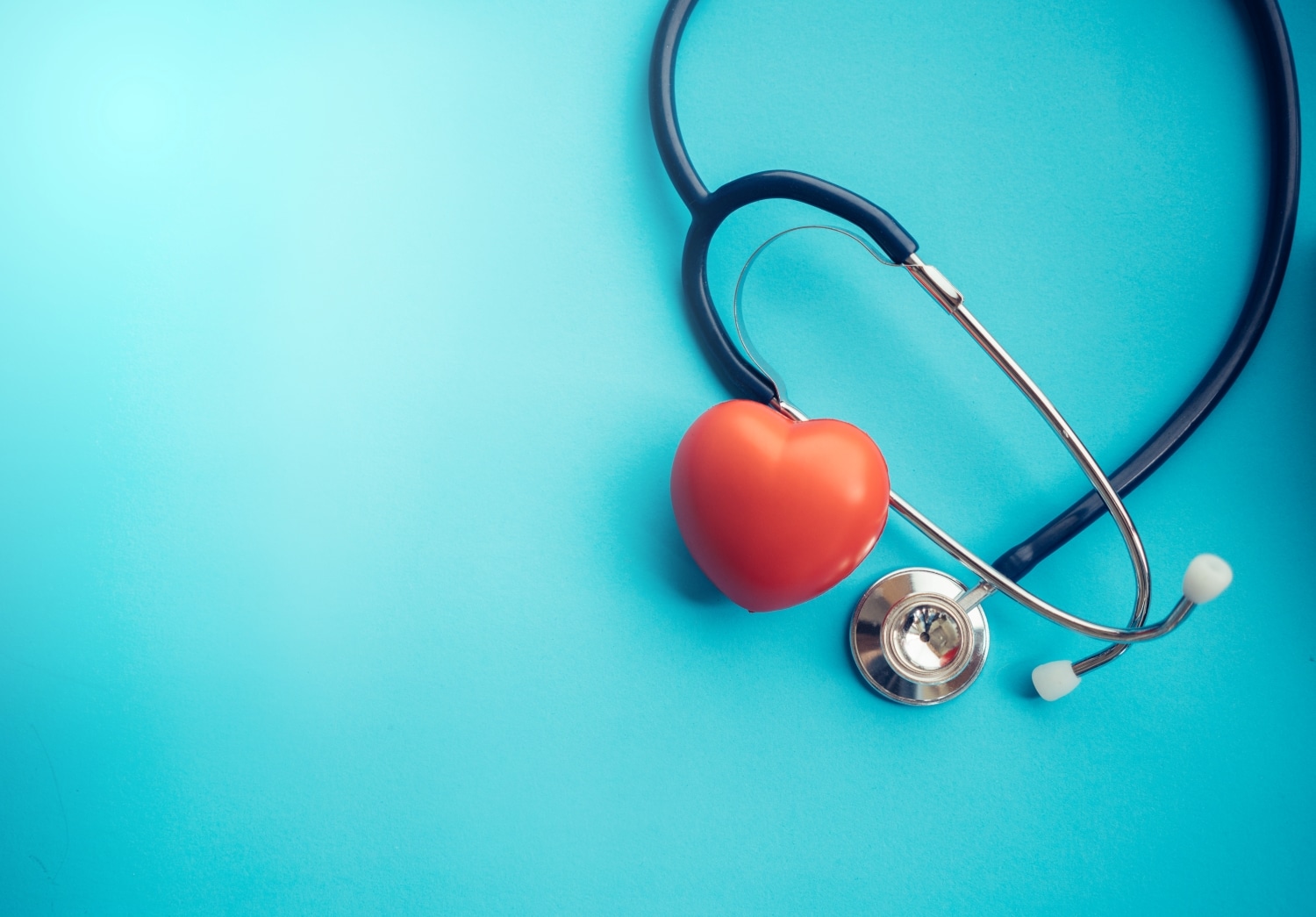 Stethoscope and a heart representing healthcare concept.